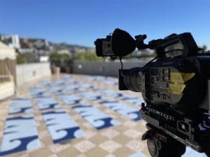 Digital video production from behind the camera during an interview