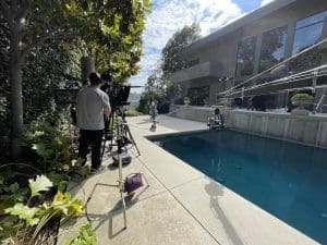 Video production outside near a pool